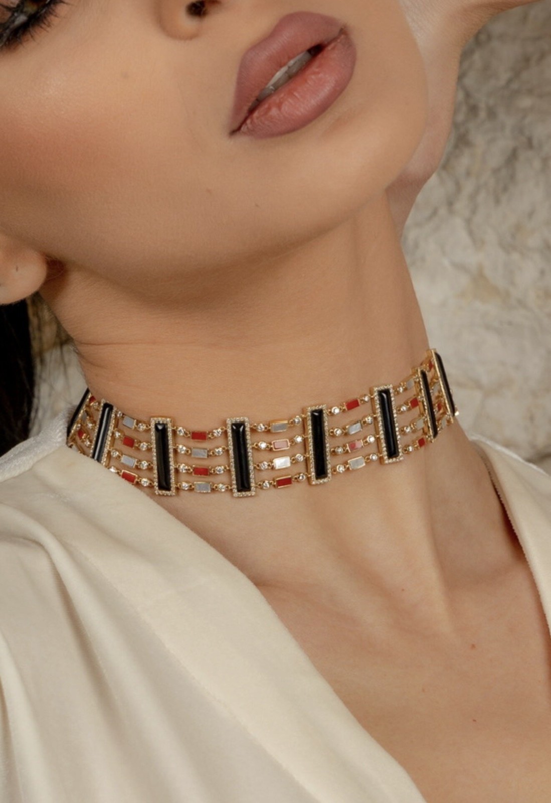 Side profile of the Sahara Statement Choker necklace worn around a woman's neck